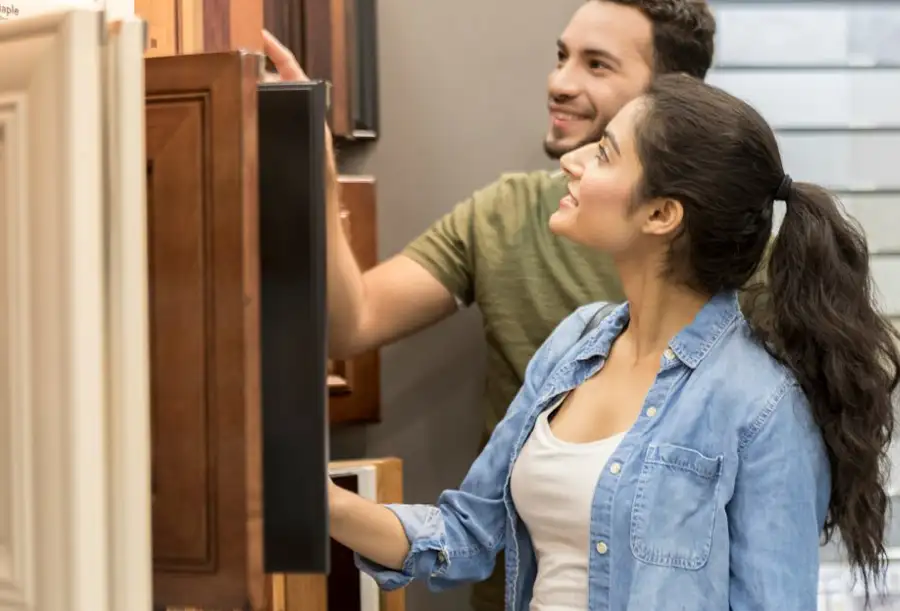Cabinetland of Springfield, Inc. - young couple browsing cabinet samples in showroom in Springfield, IL